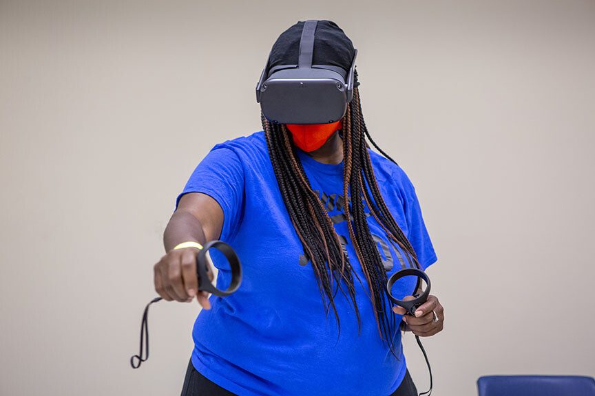 Student in blue tshirt wearing vr headset